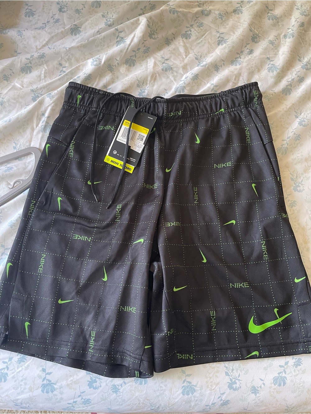 Nike Black Athletic Shorts with Neon Green Swoosh Pattern